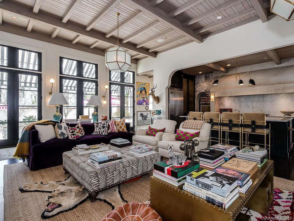661 Colville Road Charlotte, NC 28207 - Photo 14 of 36 a living room with lots of furniture and a table