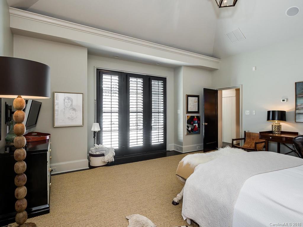 661 Colville Road Charlotte, NC 28207 - Photo 17 of 36 a bedroom with bed and large windows