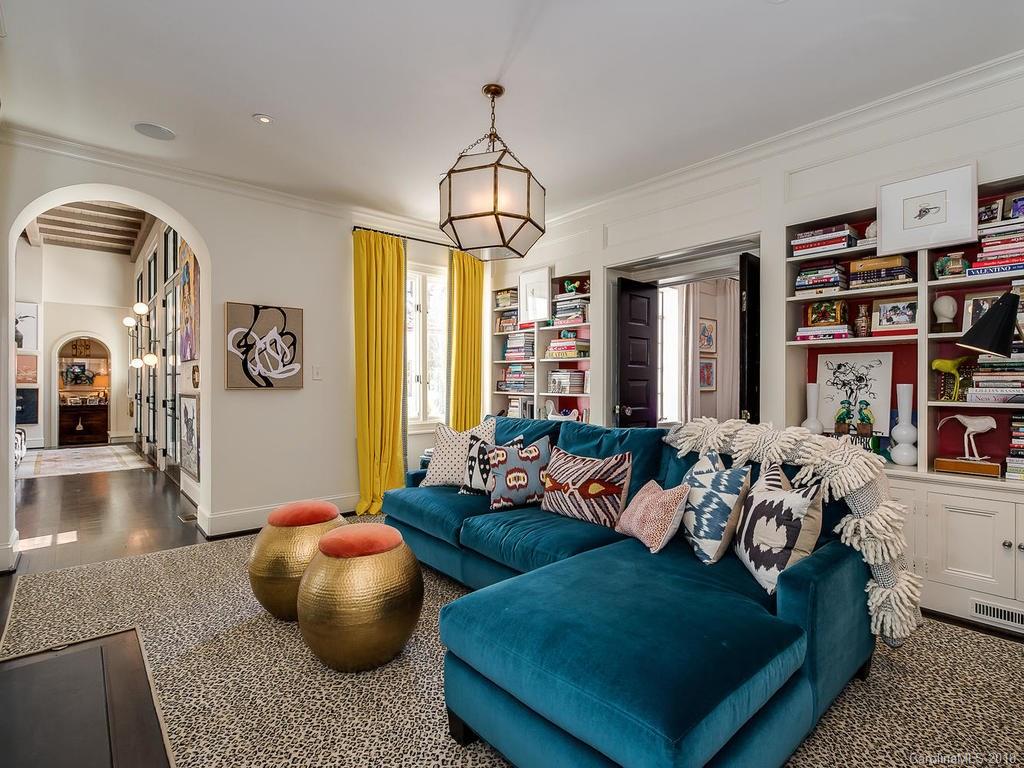 661 Colville Road Charlotte, NC 28207 - Photo 19 of 36 a living room with furniture and a book shelf