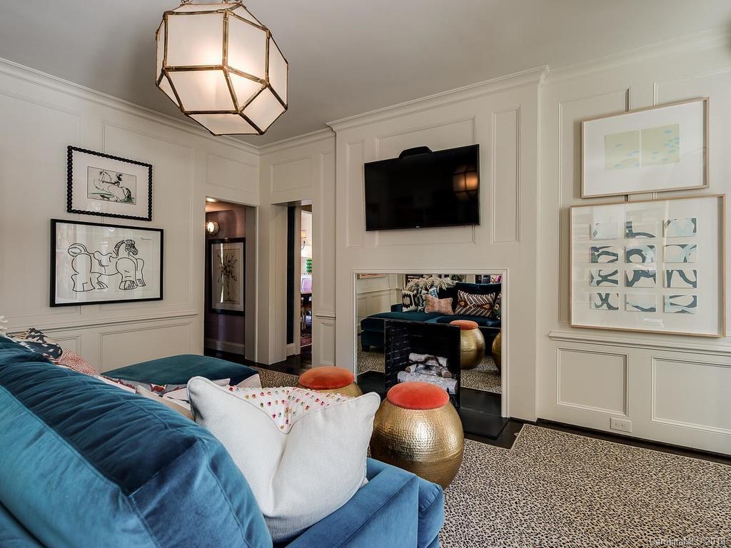 661 Colville Road Charlotte, NC 28207 - Photo 20 of 36 a living room with furniture and a flat screen tv