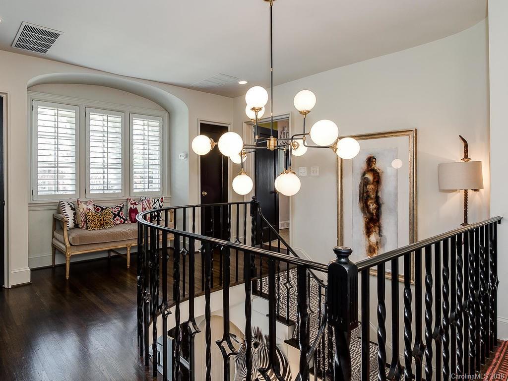 661 Colville Road Charlotte, NC 28207 - Photo 21 of 36 a view of a dining room and hall with wooden floor