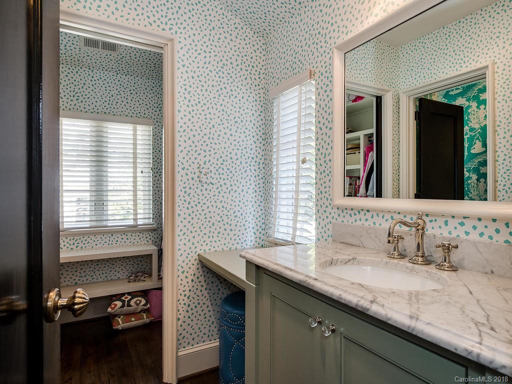 661 Colville Road Charlotte, NC 28207 - Photo 26 of 36 a en suite bathroom with a granite countertop sink and a mirror