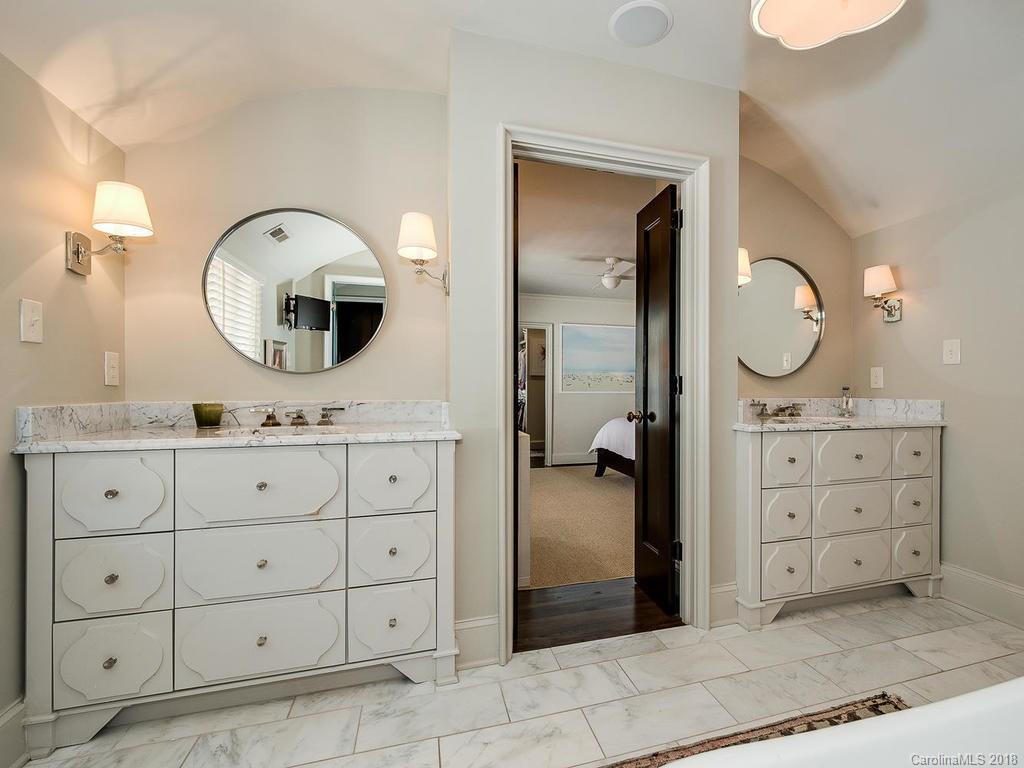 661 Colville Road Charlotte, NC 28207 - Photo 29 of 36 a bathroom with a sink a vanity and a mirror