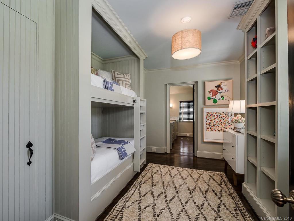 661 Colville Road Charlotte, NC 28207 - Photo 30 of 36 a hallway with cabinets and wooden floor