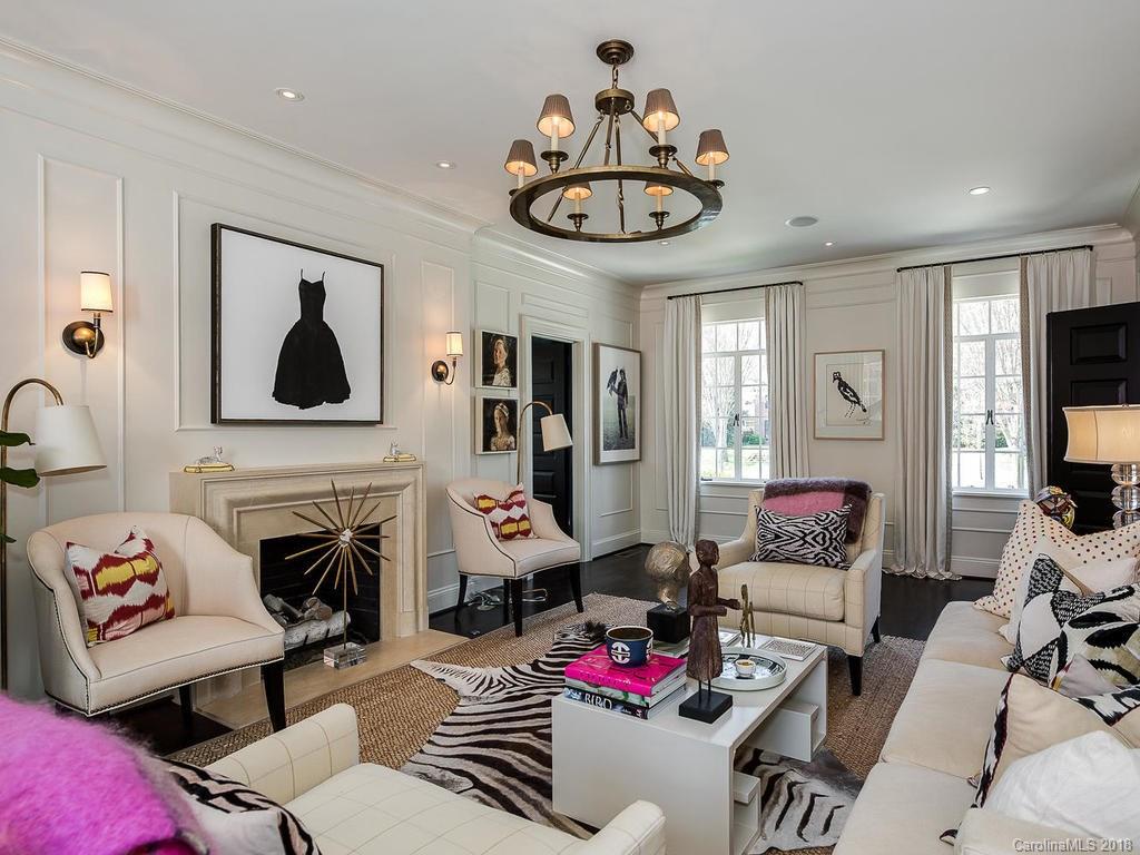 661 Colville Road Charlotte, NC 28207 - Photo 4 of 36 a living room with furniture kitchen and a fireplace