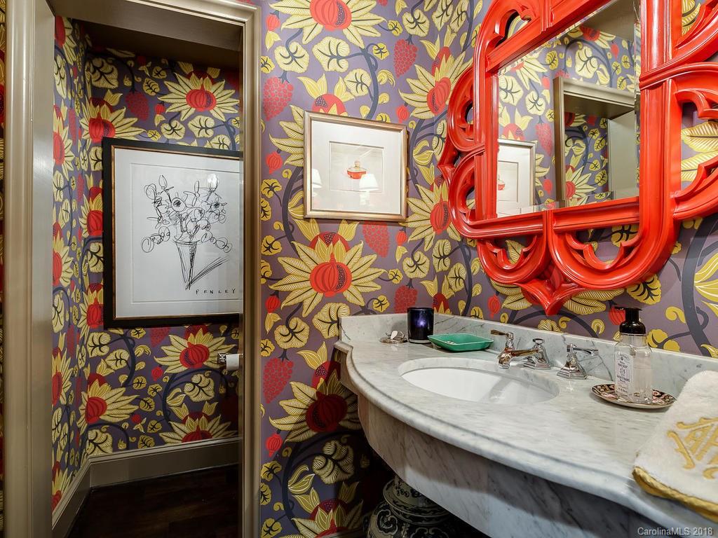 661 Colville Road Charlotte, NC 28207 - Photo 32 of 36 a bathroom with a sink a vanity and a mirror