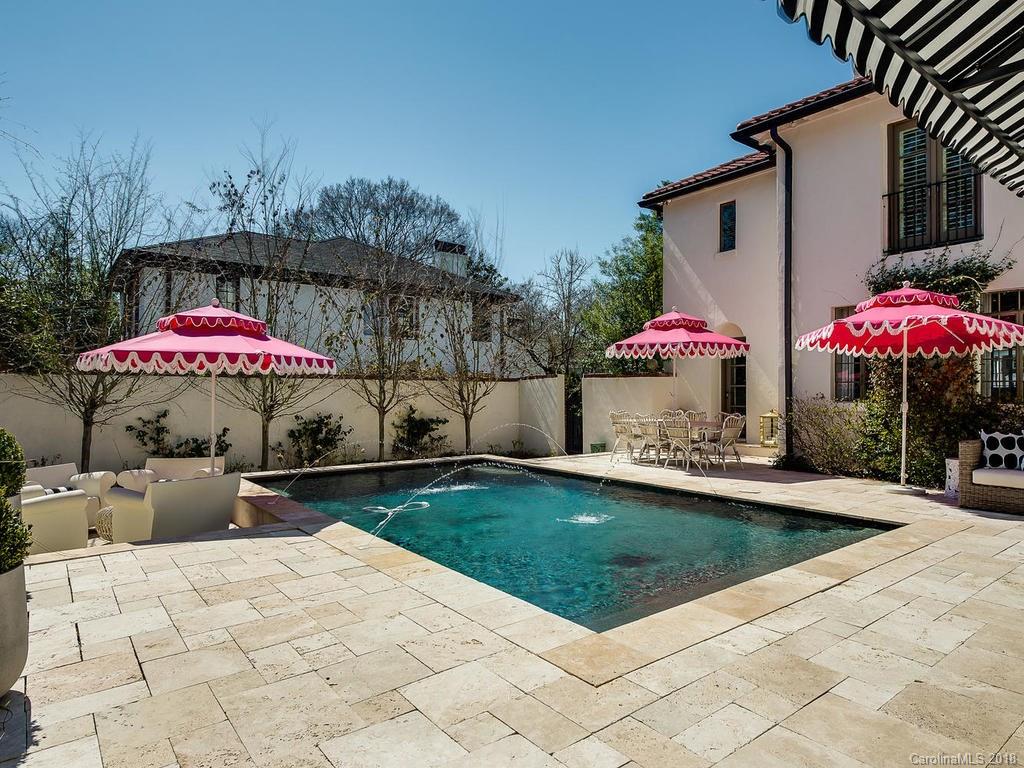 661 Colville Road Charlotte, NC 28207 - Photo 33 of 36 a view of a patio with furniture and a fire pit