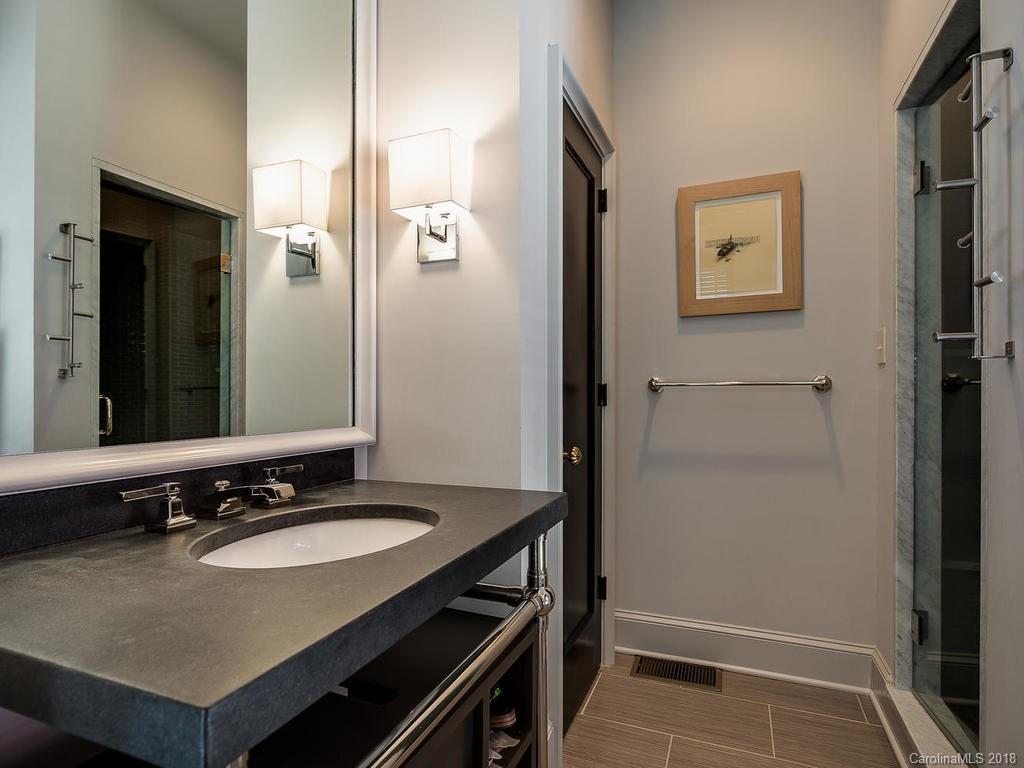 661 Colville Road Charlotte, NC 28207 - Photo 35 of 36 a bathroom with a sink and a mirror