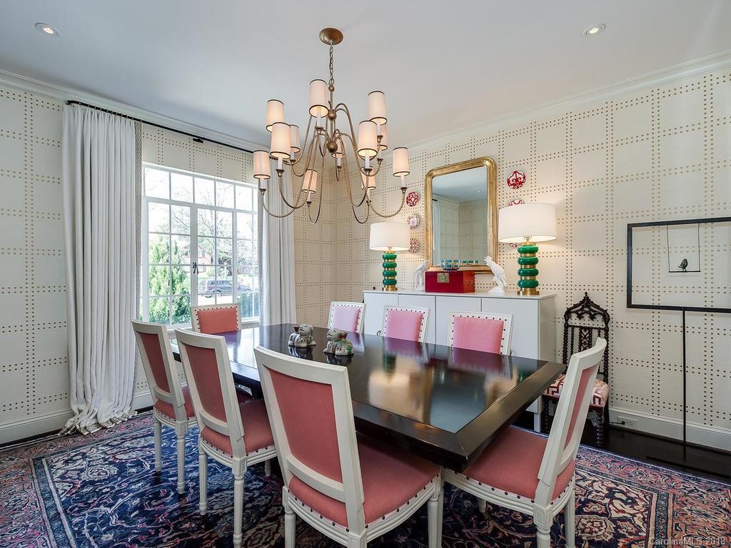 661 Colville Road Charlotte, NC 28207 - Photo 6 of 36 a dining room with furniture a chandelier and wooden floor