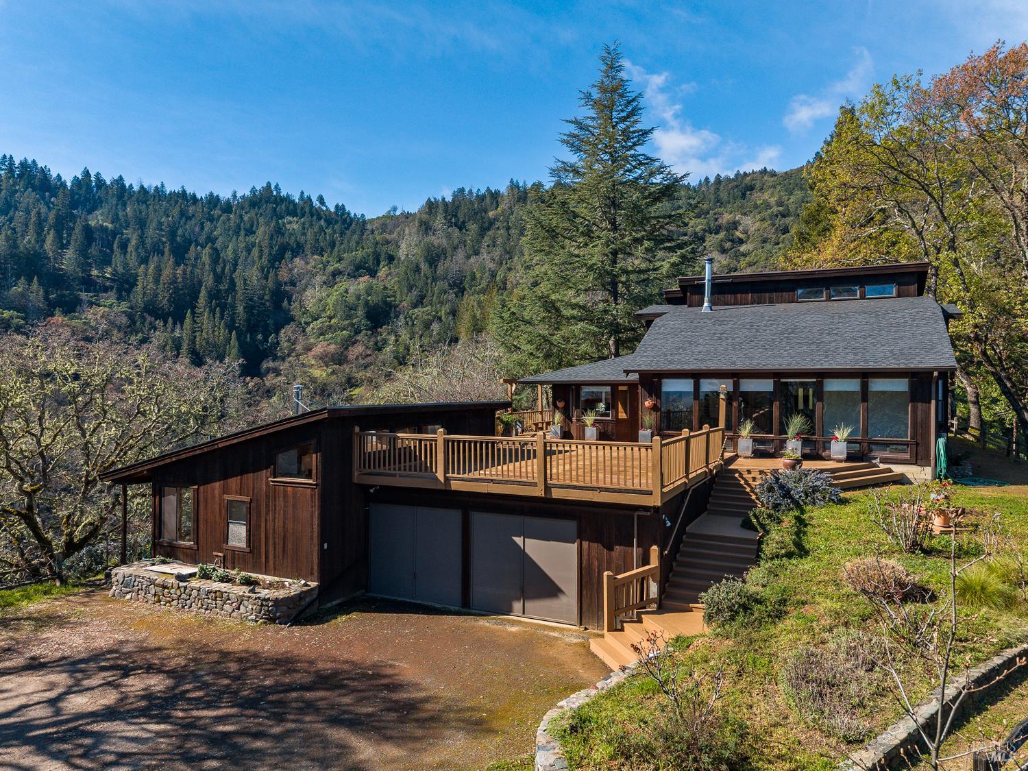 1411 Oak Knoll Road Ukiah, CA 95482 - Photo 1 of 45 a front view of a house with a yard