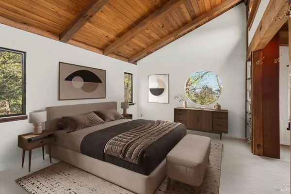 a bedroom with bed and a window