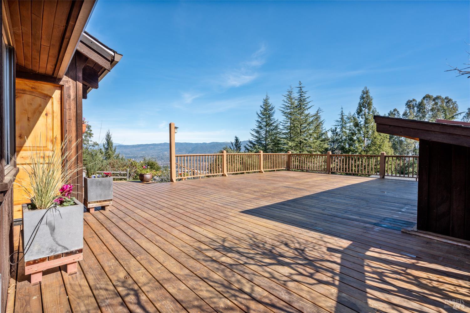 1411 Oak Knoll Road Ukiah, CA 95482 - Photo 25 of 45 a view of a terrace with wooden floor and iron stairs