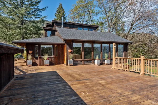 a view of a house with porch and wooden floor