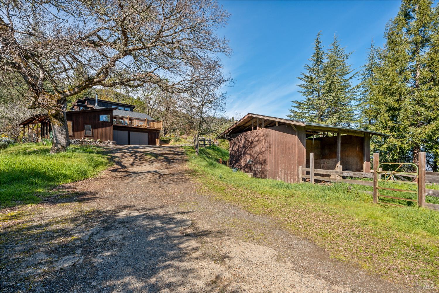1411 Oak Knoll Road Ukiah, CA 95482 - Photo 32 of 45 a view of a house with backyard and sitting area