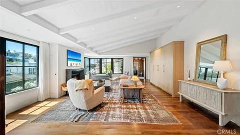 a living room with furniture rug and window
