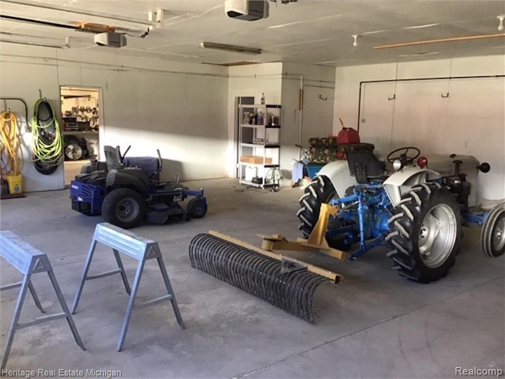 6711 Sharpe Road Fowlerville, MI 48836 - Photo 6 of 47 Spacious garage interior