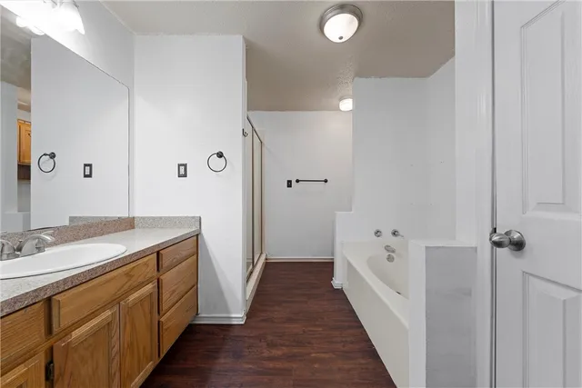 a bathroom with a sink a mirror and a shower