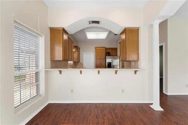 a view of a bathroom with sink and mirror