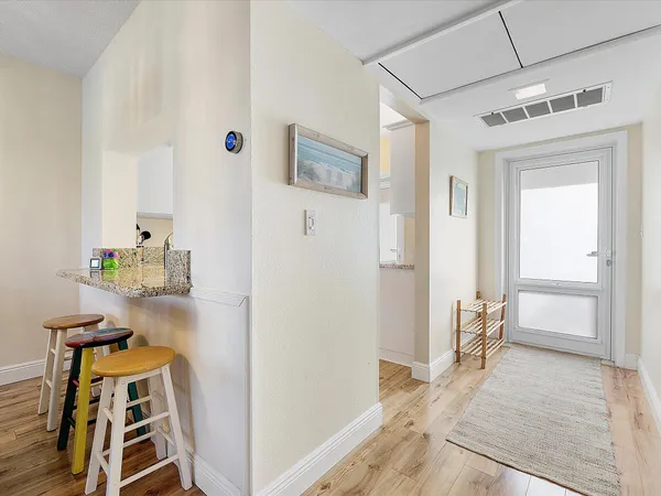 a view of an entryway with wooden floor