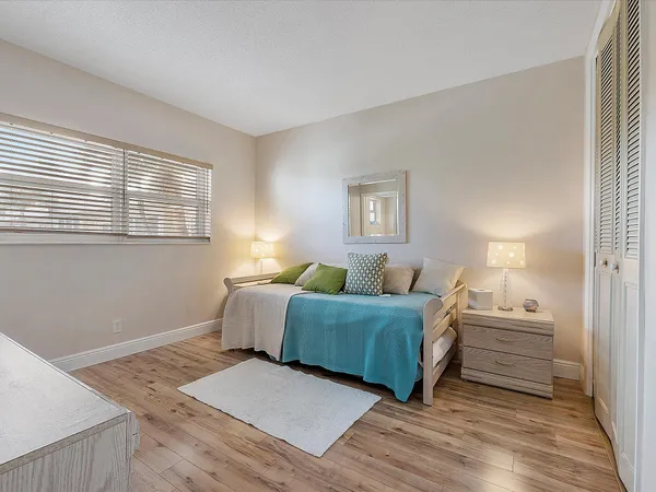 a room with a bed and a window