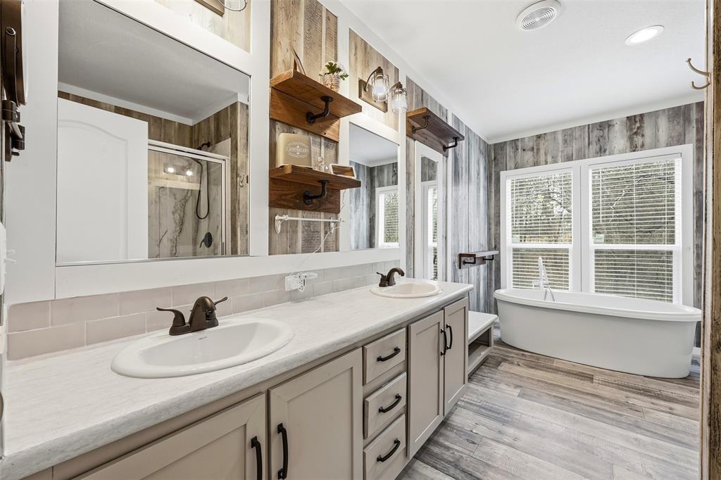 2114 Hickory Street Mabank, TX 75156 - Photo 12 of 31 Primary bathroom with dual sinks and soaking tub