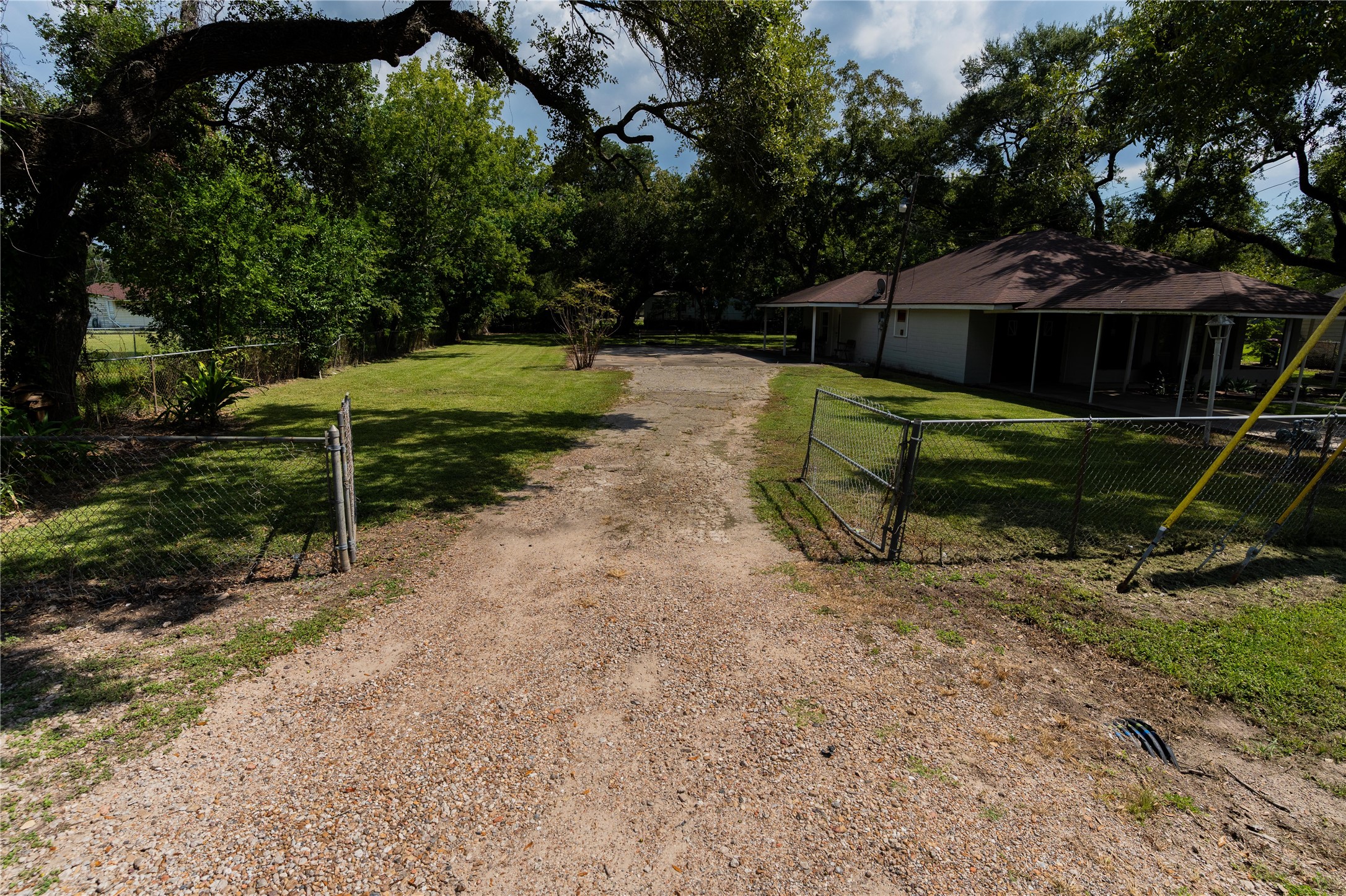 417 Hardy Street Clute, TX 77531 - Photo 19 of 28 a view of a bench in a backyard