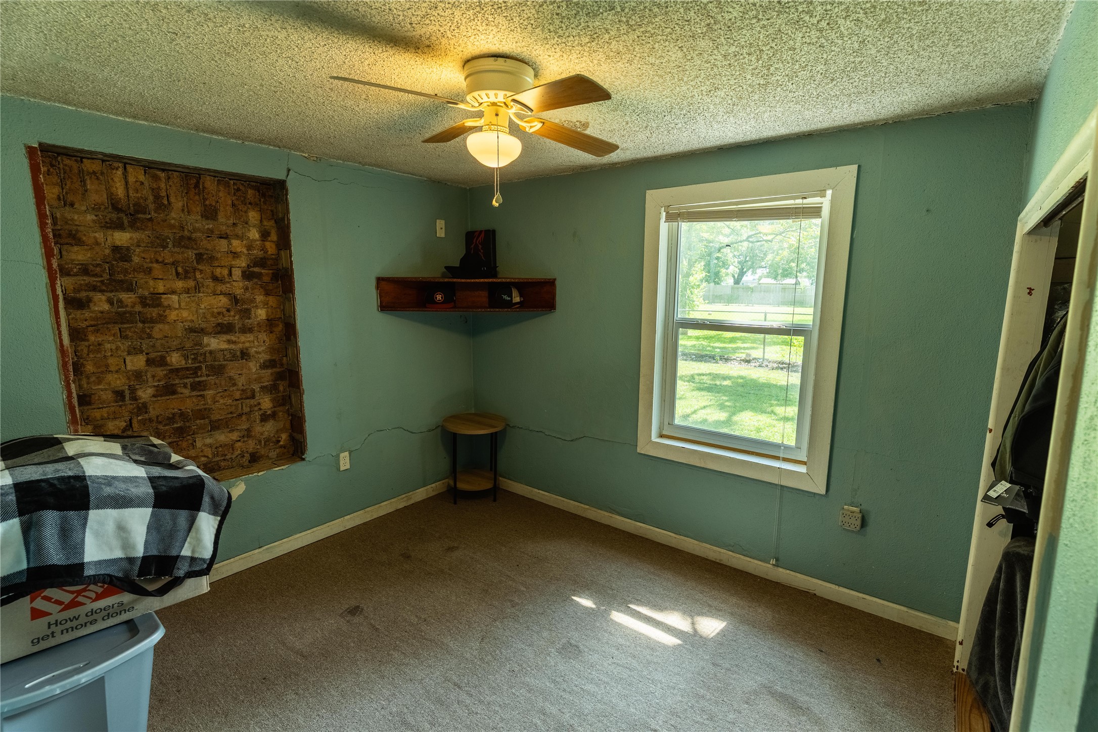 417 Hardy Street Clute, TX 77531 - Photo 8 of 28 a view of room with window and ceiling fan