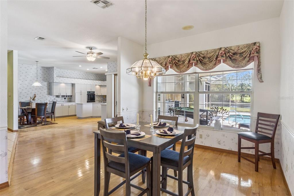 2964 Plantation Road Winter Haven, FL 33884 - Photo 15 of 42 a view of a dining room with furniture window and wooden floor