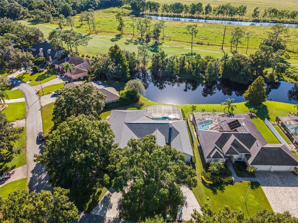 2964 Plantation Road Winter Haven, FL 33884 - Photo 34 of 42 an aerial view of a swimming pool with outdoor seating and yard