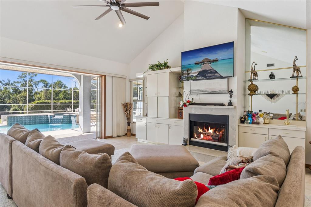 2964 Plantation Road Winter Haven, FL 33884 - Photo 6 of 42 a living room with furniture and a fireplace
