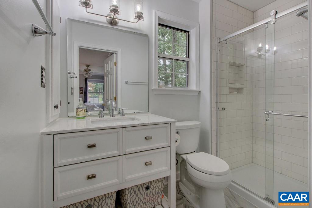 809 Harris Road Charlottesville, VA 22902 - Photo 20 of 39 a bathroom with a sink a toilet and shower