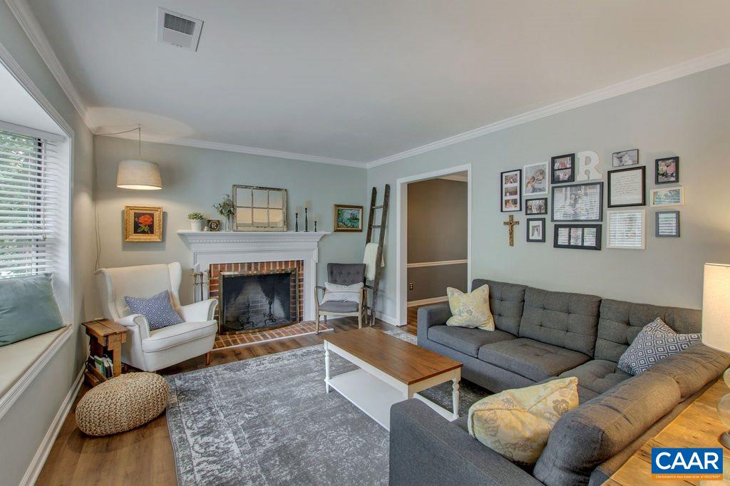 809 Harris Road Charlottesville, VA 22902 - Photo 7 of 39 a living room with furniture and a fireplace