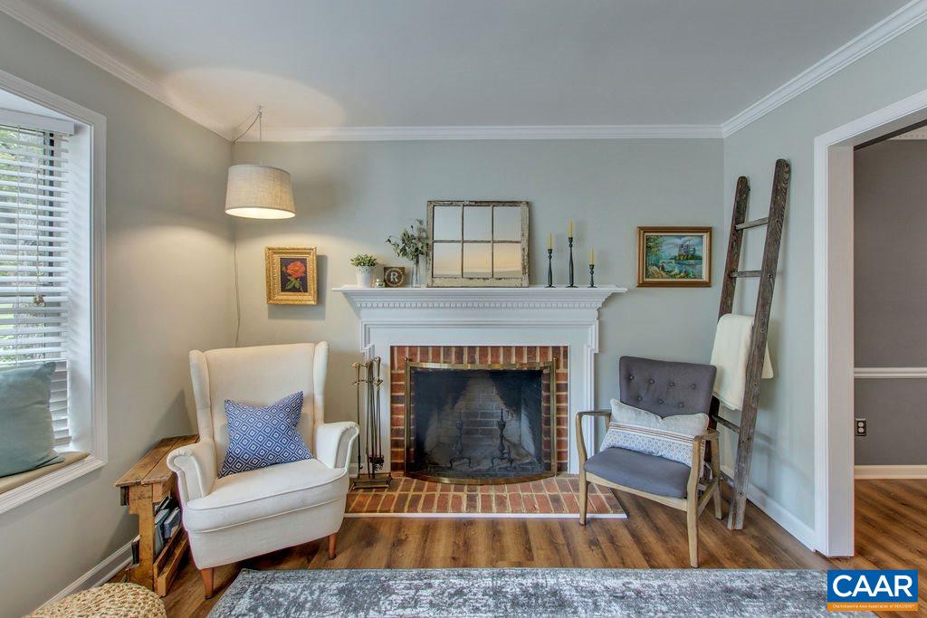 809 Harris Road Charlottesville, VA 22902 - Photo 8 of 39 a living room with furniture and a fireplace