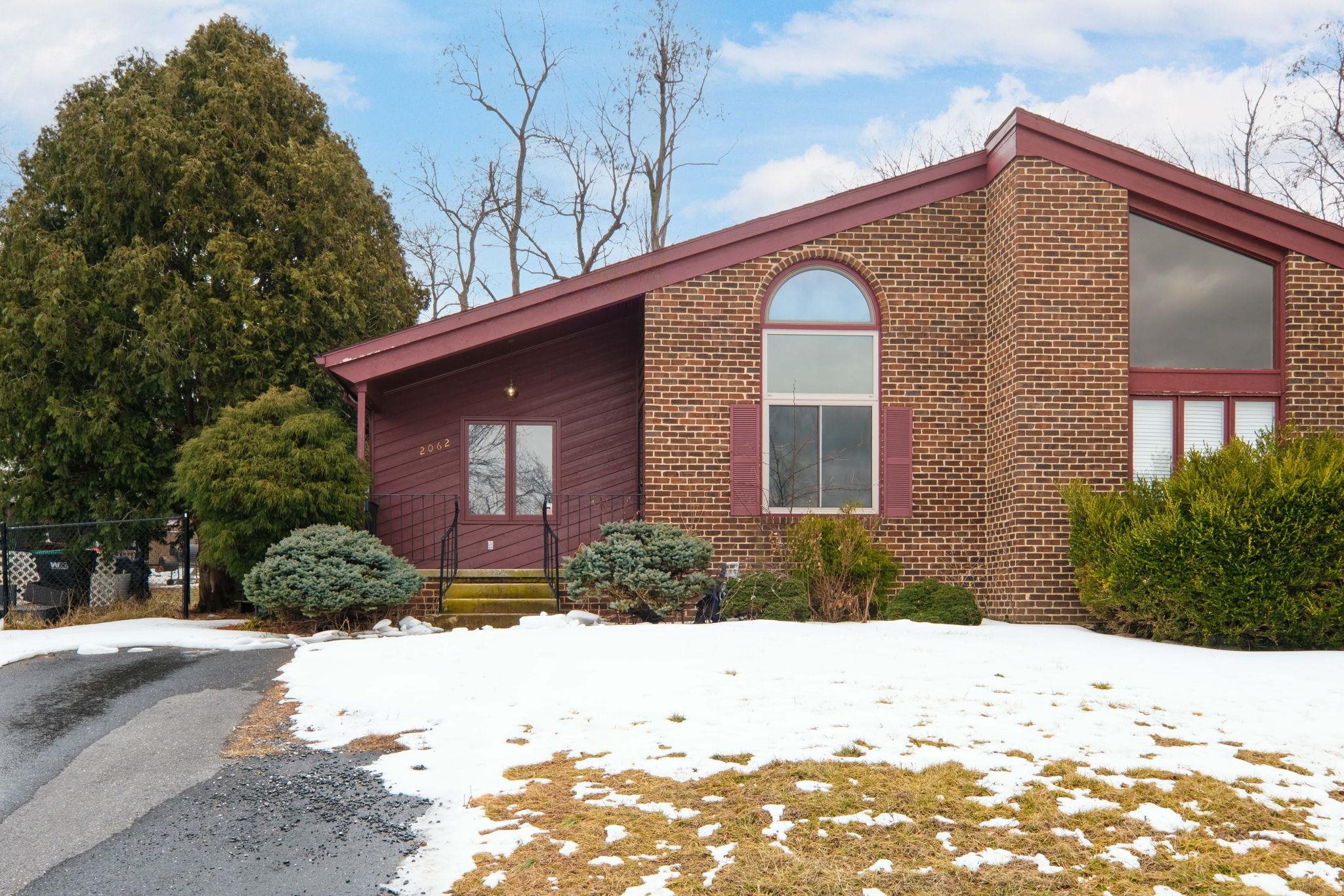 2062 Rosedale Court Harrisonburg, VA 22801 - Photo 2 of 24 a front view of a house with a yard