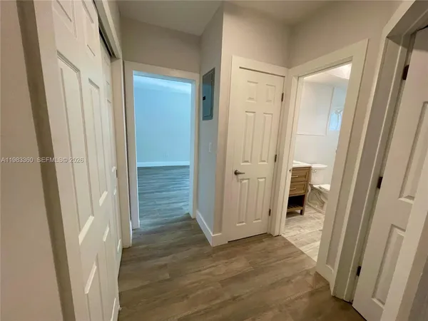 a view of a bathroom from a door