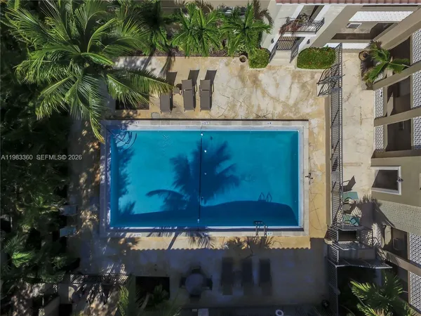 a view of a house with a door and a tree