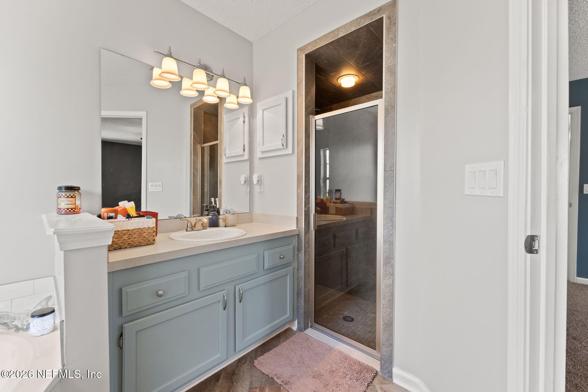 2982 Chief Ridaught Trail Middleburg, FL 32068 - Photo 21 of 29 a bathroom with a double vanity sink and a mirror