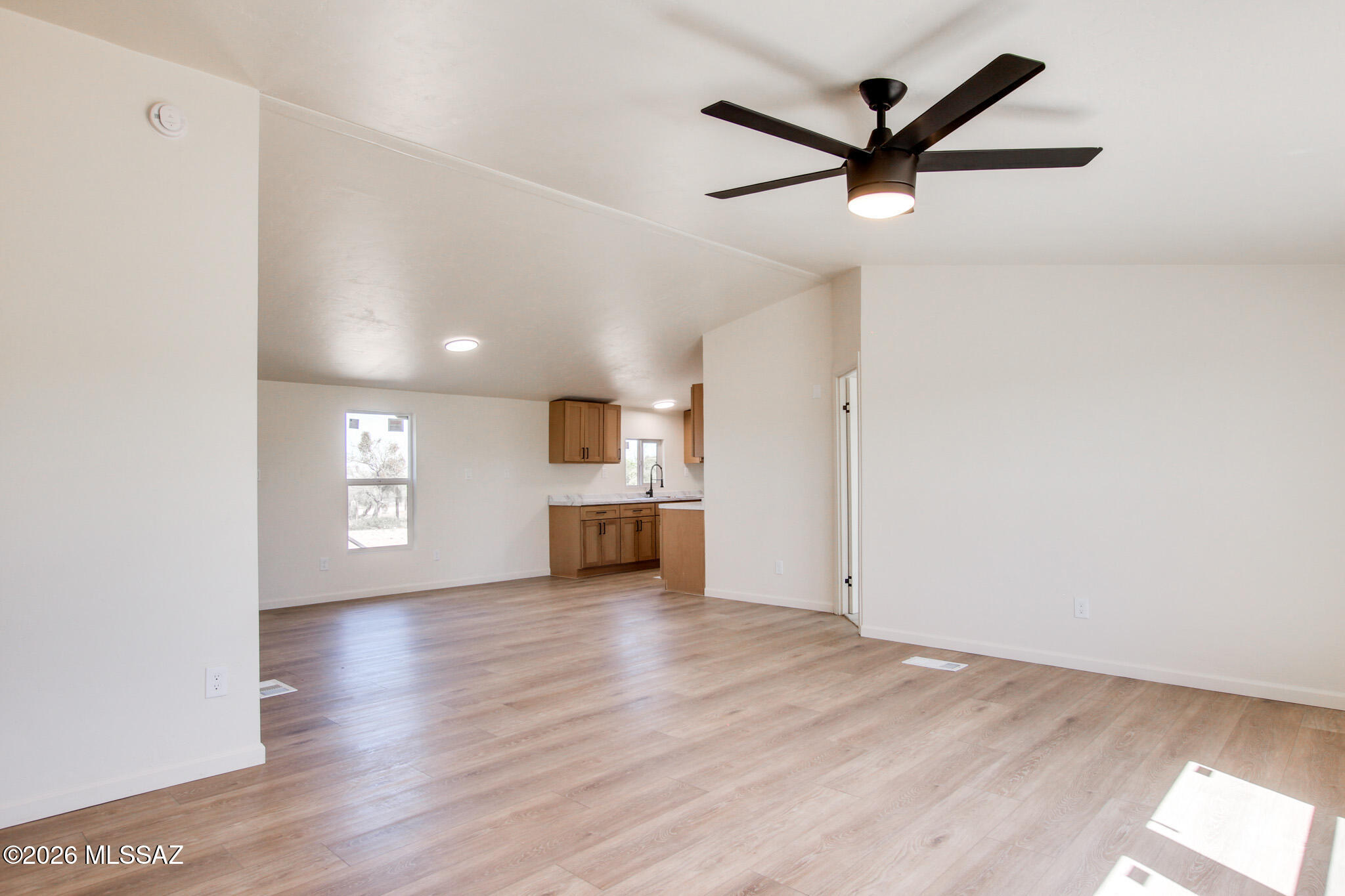 14303 West Rolina Lane Tucson, AZ 85736 - Photo 13 of 38 a view of empty room with wooden floor and ceiling fan