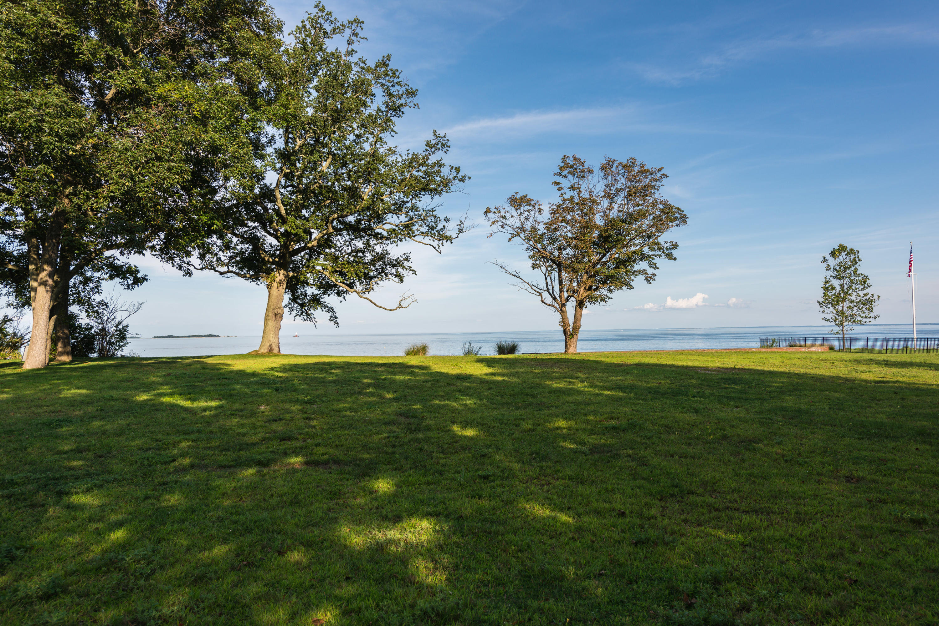 241 Long Neck Point Road Darien, CT 06820 - Photo 17 of 29 a view of yard with swimming pool and green space