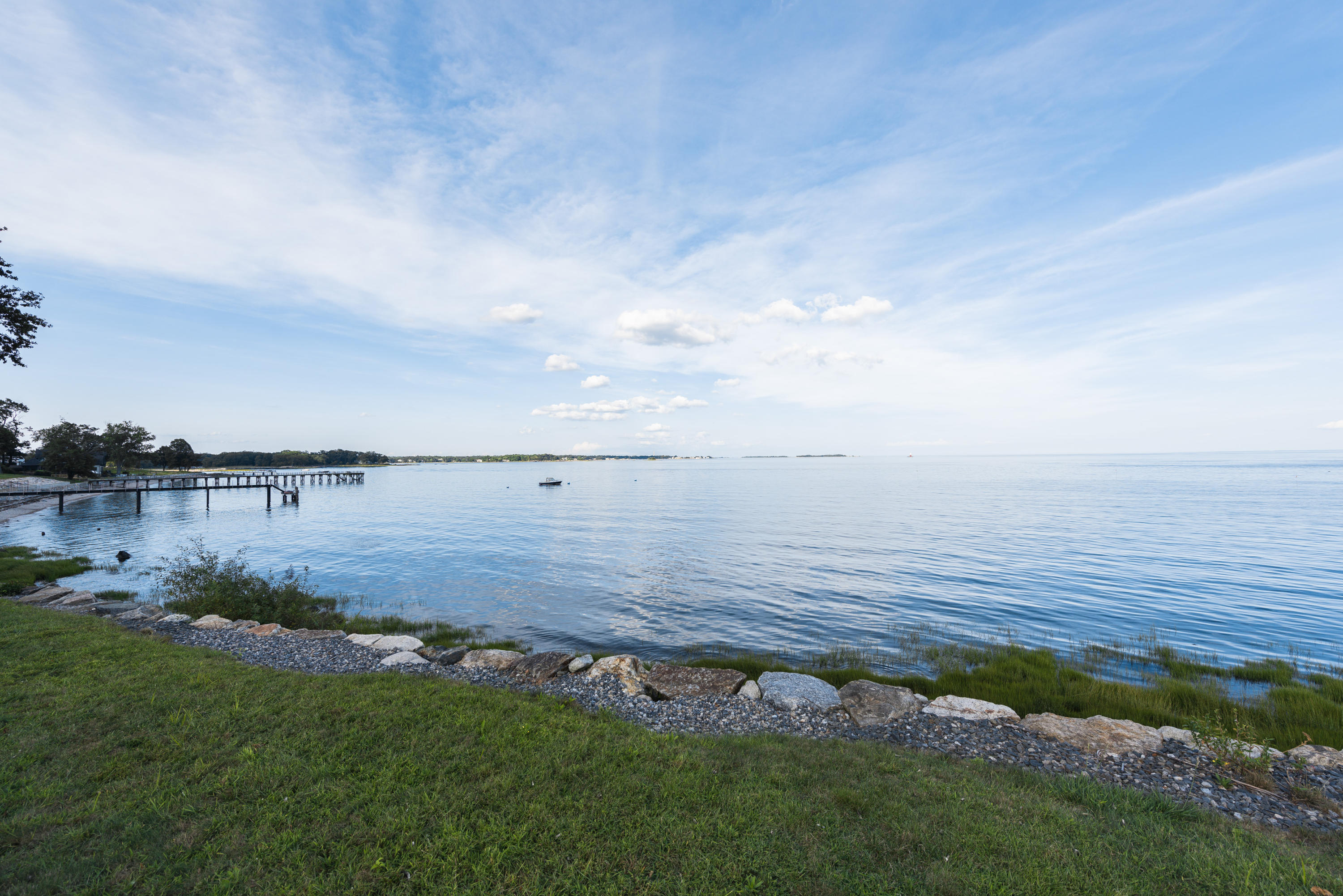 241 Long Neck Point Road Darien, CT 06820 - Photo 20 of 29 a view of a lake from a yard