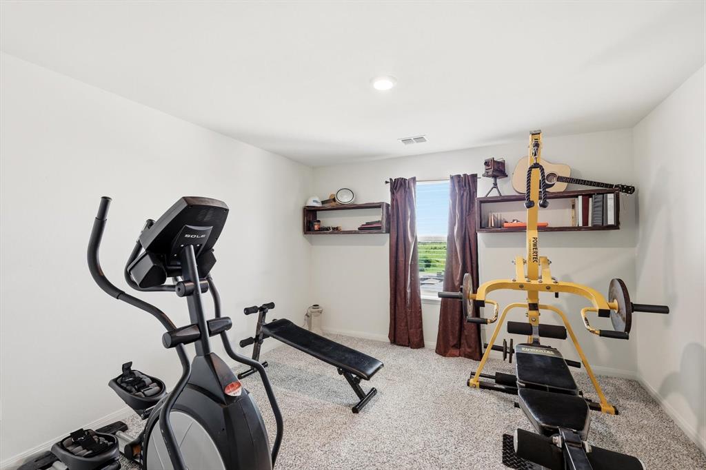 189 Point Rider Road Newark, TX 76071 - Photo 8 of 14 a view of a room with gym equipment