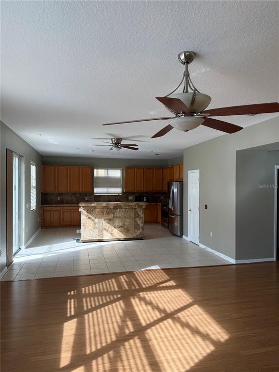 1037 Berkeley Drive Kissimmee, FL 34744 - Photo 5 of 38 a view of a kitchen with a sink and a chandelier