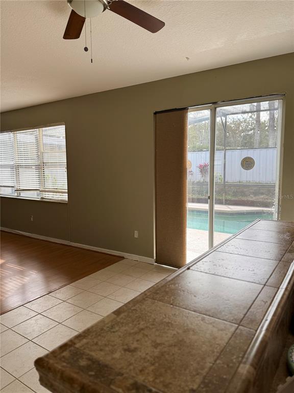 1037 Berkeley Drive Kissimmee, FL 34744 - Photo 8 of 38 a view of an empty room with a window