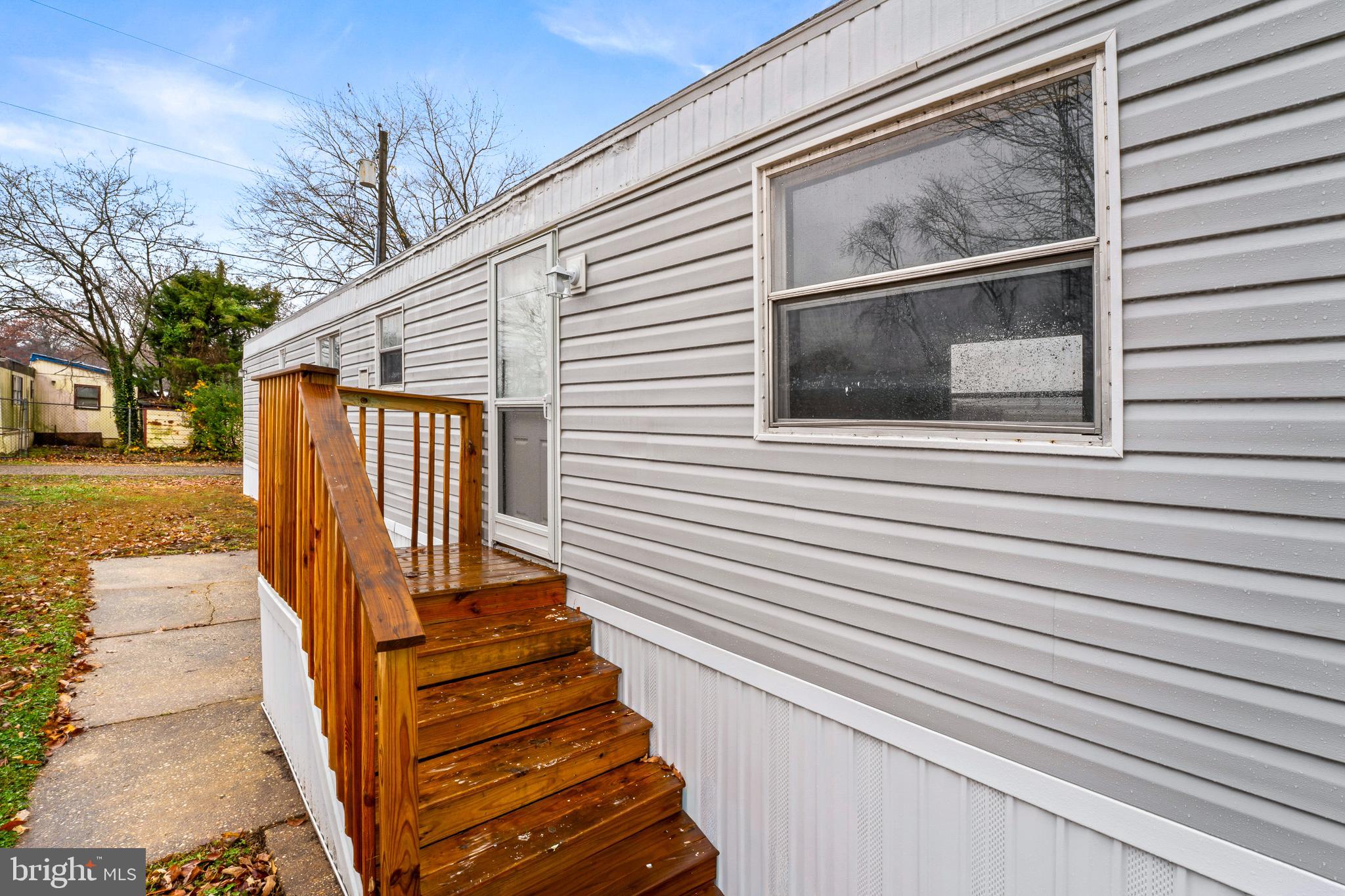 a view of a door of the house with a street