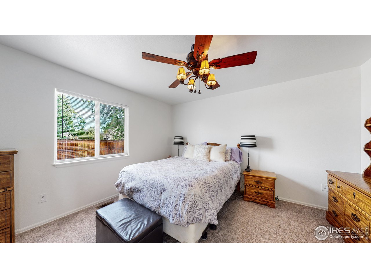 3588 Calico Court Mead, CO 80542 - Photo 11 of 28 a living room with furniture and a window