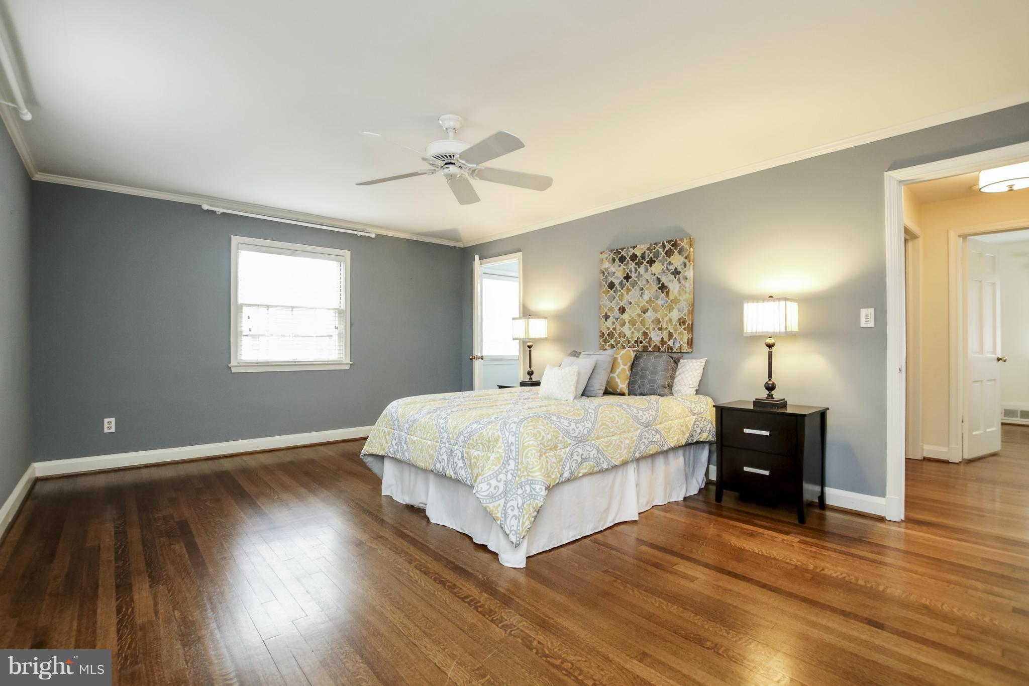 116 Croydon Road Baltimore, MD 21212 - Photo 14 of 30 a bedroom with a bed and wooden floor