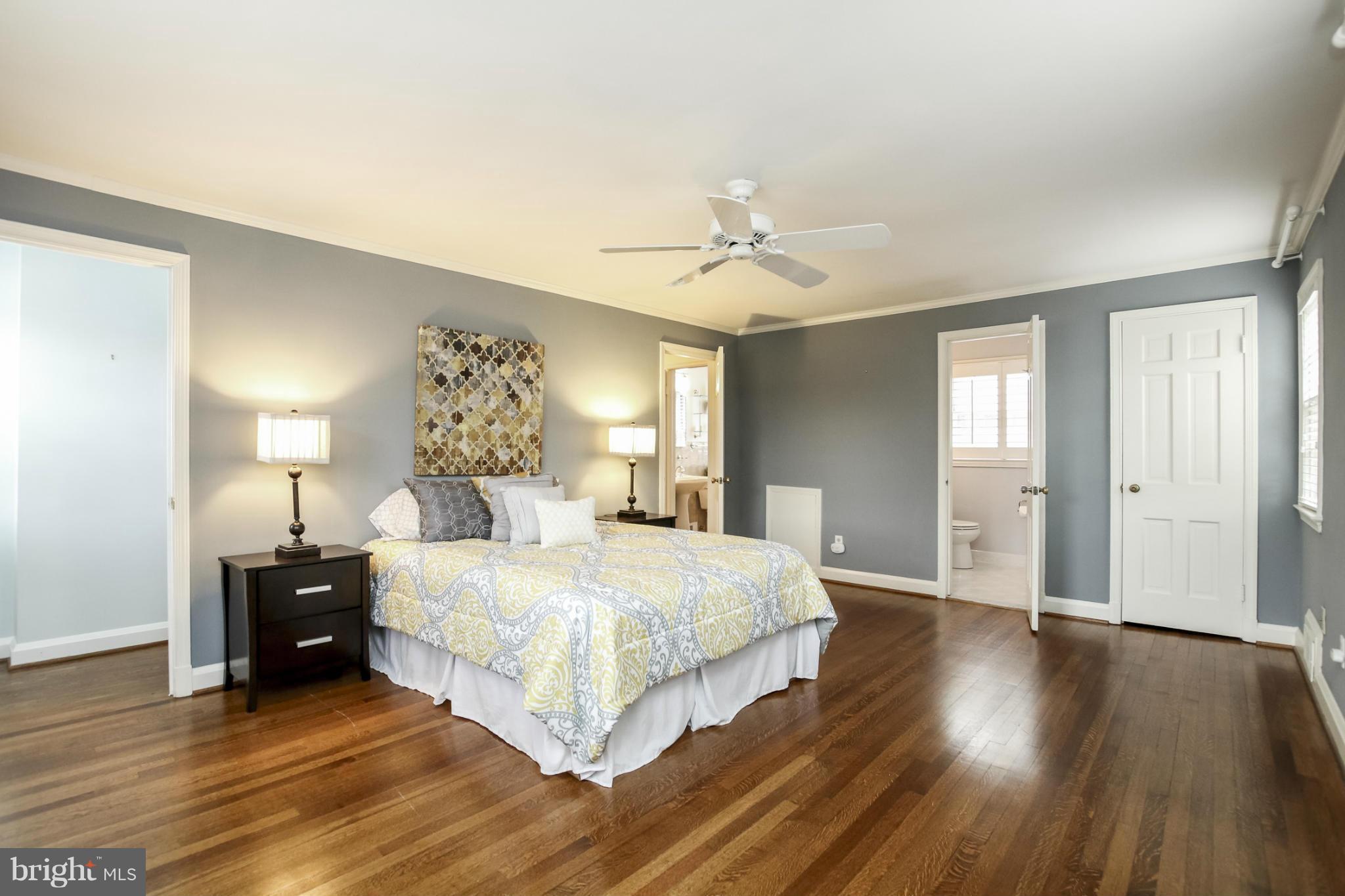 116 Croydon Road Baltimore, MD 21212 - Photo 15 of 30 a spacious bedroom with a bed and wooden floor