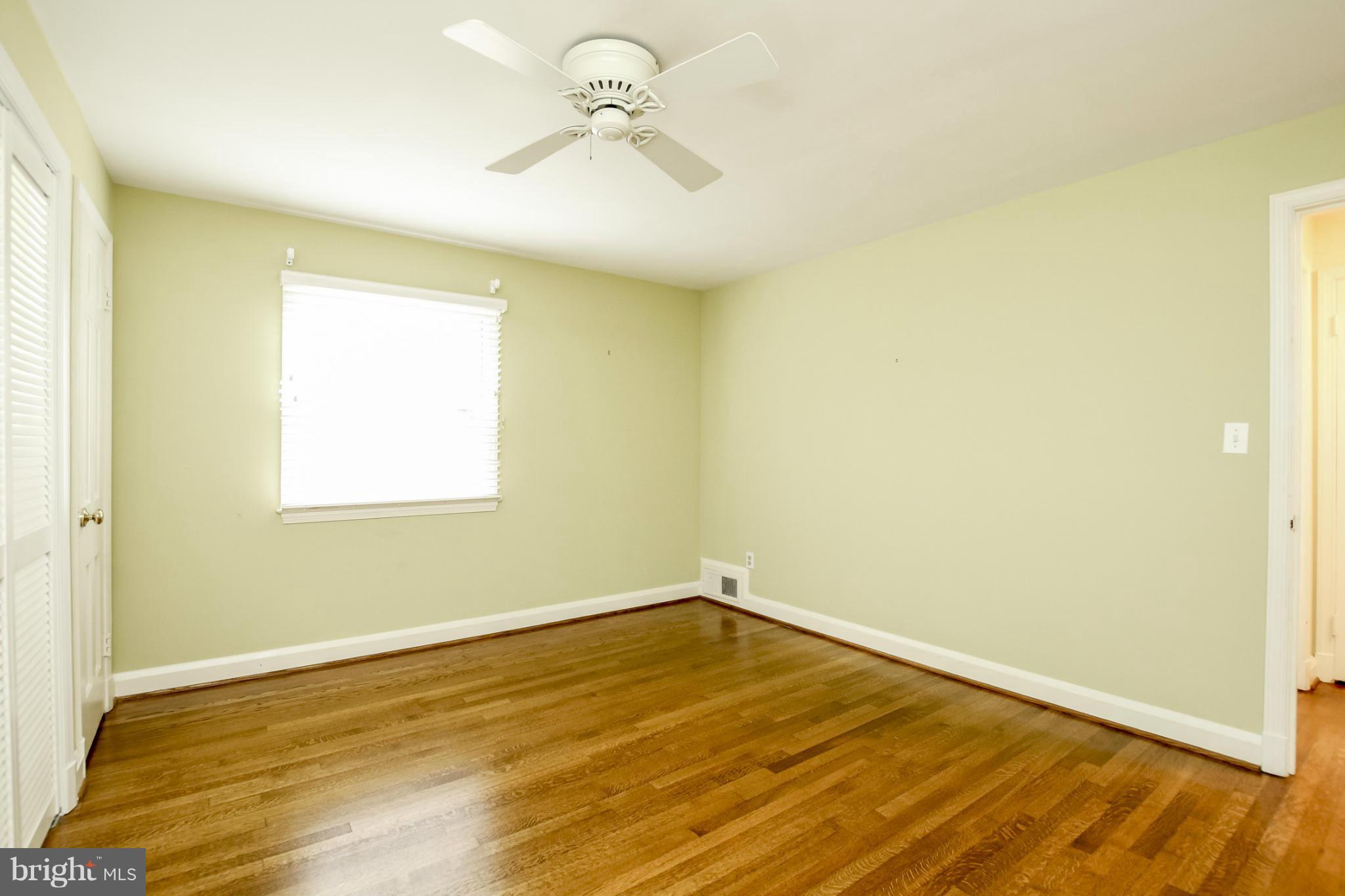 116 Croydon Road Baltimore, MD 21212 - Photo 18 of 30 a view of a room with wooden floor and a window