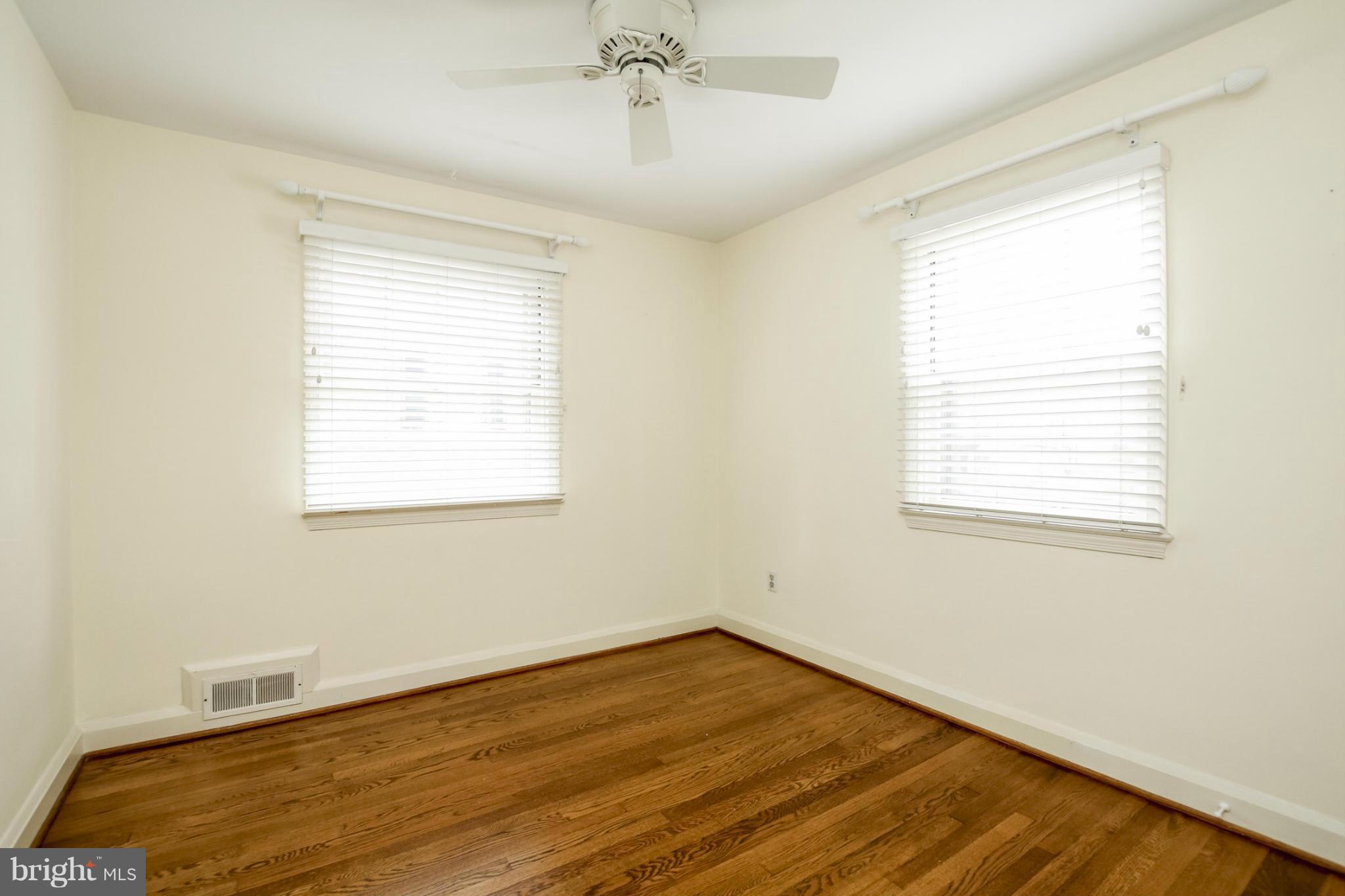 116 Croydon Road Baltimore, MD 21212 - Photo 21 of 30 a view of an empty room with wooden floor and a window