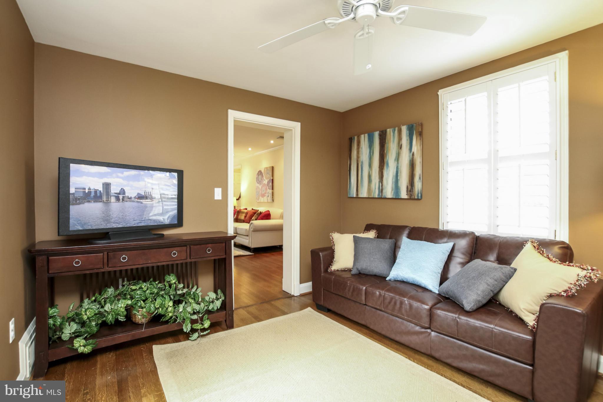 116 Croydon Road Baltimore, MD 21212 - Photo 7 of 30 a living room with furniture and a flat screen tv